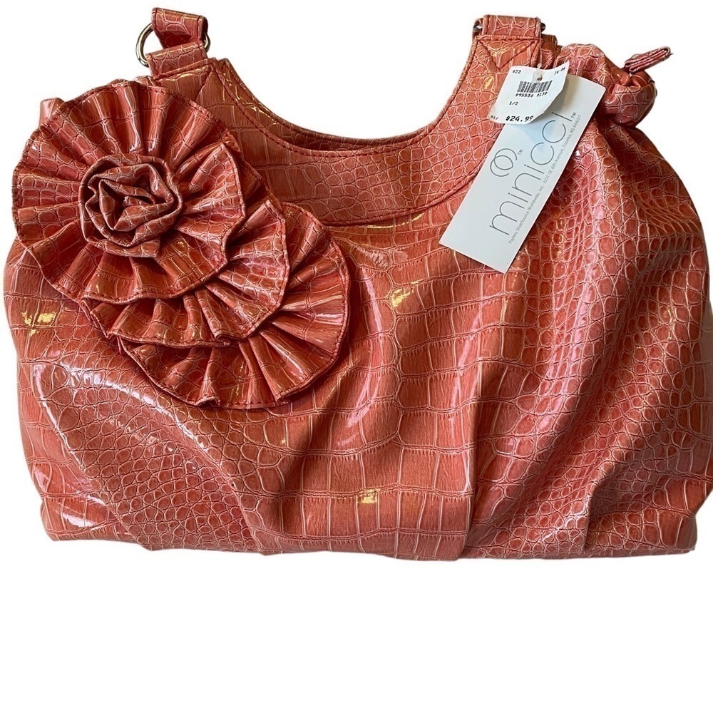 NWT minicci handbag. The color is pink.